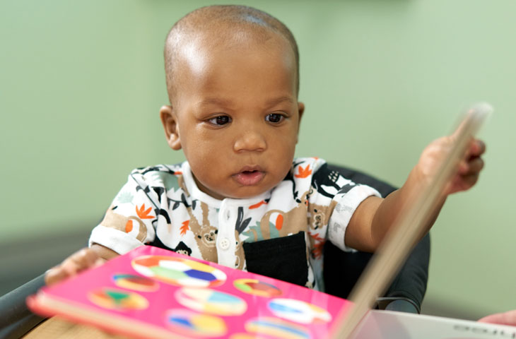 boy reading a book at Brain Health Center